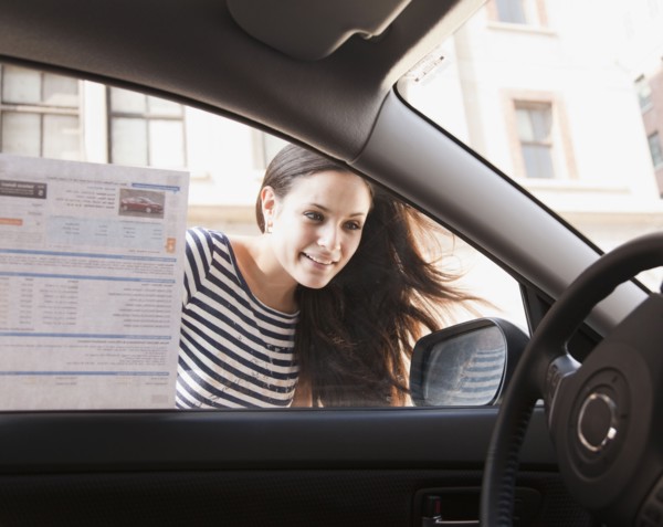 Mixed race woman shopping for new car