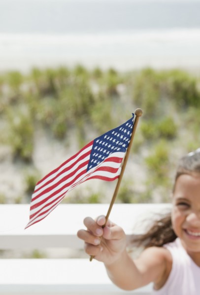 Hispanic girl holding American flag