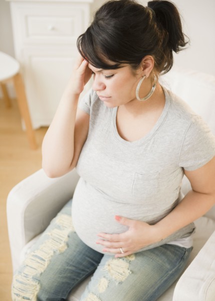 Pregnant Hispanic woman with headache