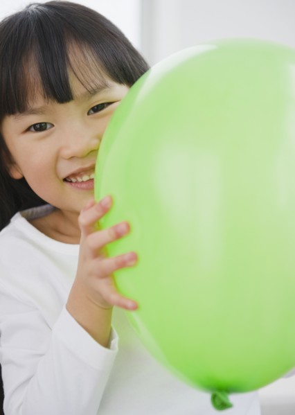 Chinese girl holding balloon