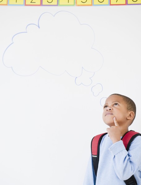 African American boy in school with thought bubble