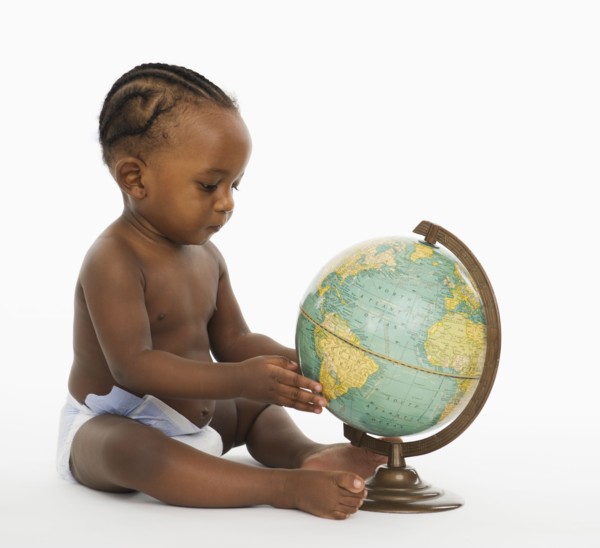 African American baby looking at globe