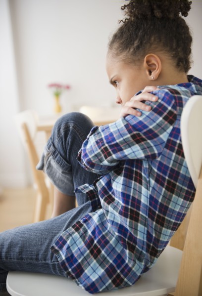 African American girl having temper tantrum