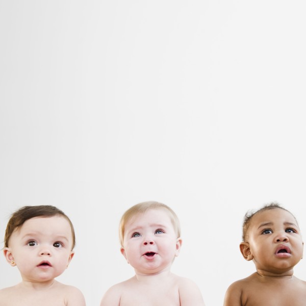 Curious babies sitting in a row