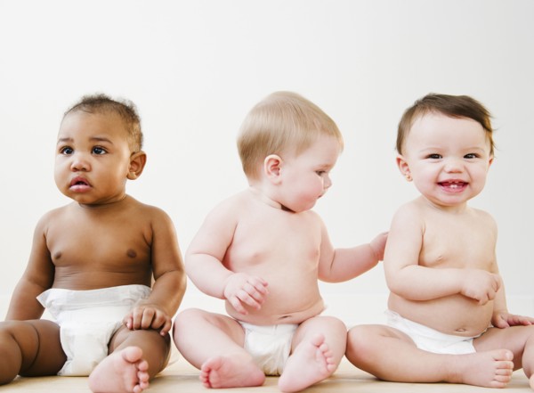 Babies sitting together on floor