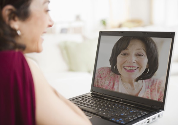 Mother and daughter talking over video chat
