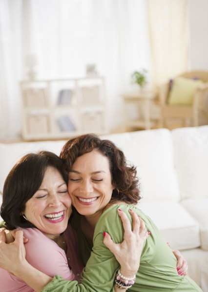 Mother and daughter hugging