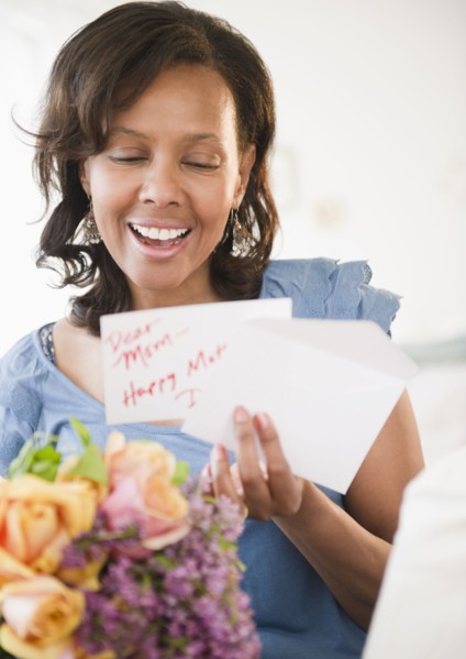 Black woman receiving bouquet of flowers