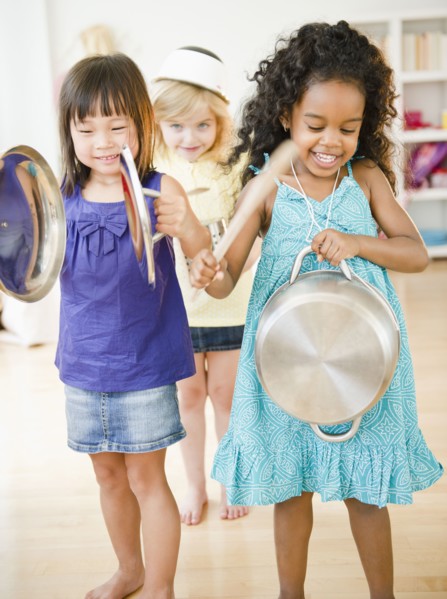 Girls making music with pots and pans