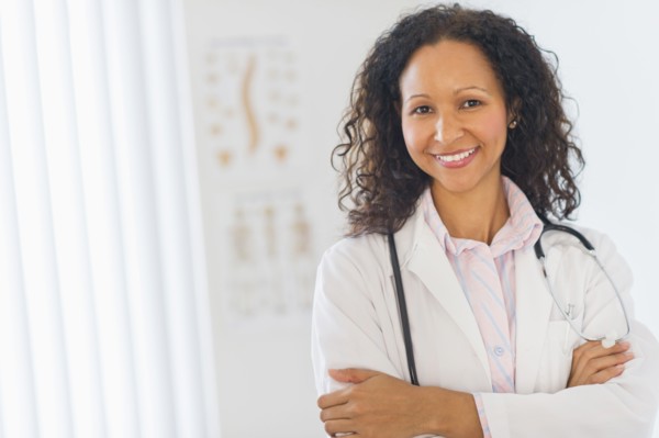 Hispanic doctor standing in hospital