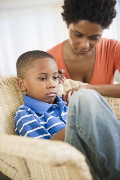 Black mother comforting son