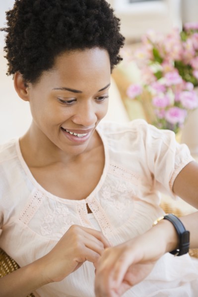 African American woman checking the time