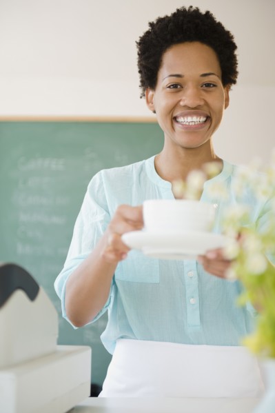 African American woman serving coffee