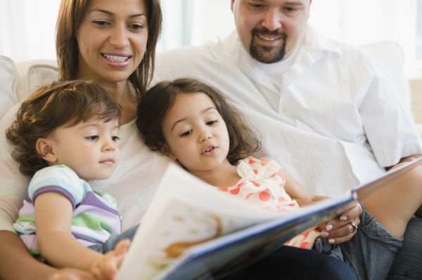 Family reading book together
