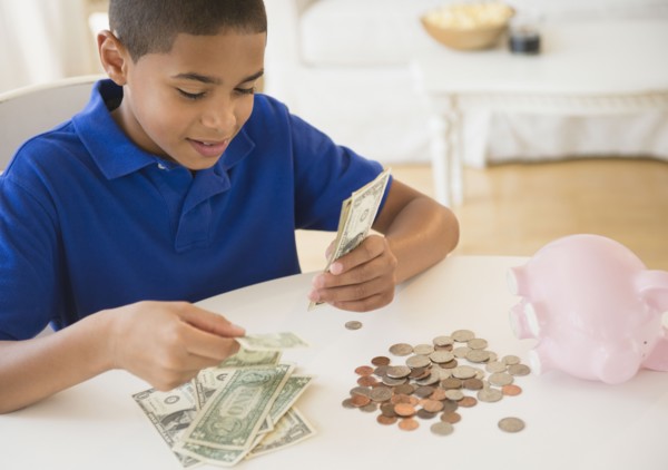 Hispanic boy counting money