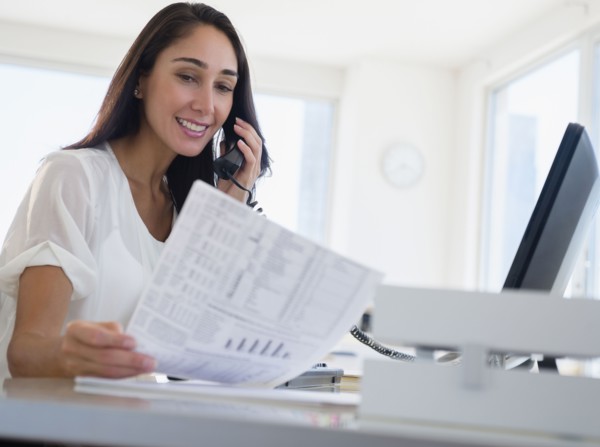 Caucasian businesswoman working at desk