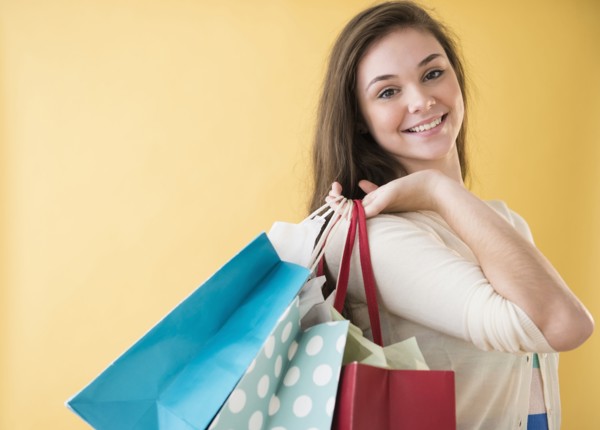 Hispanic girl carrying shopping bags