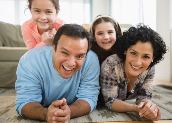 Family relaxing together in living room