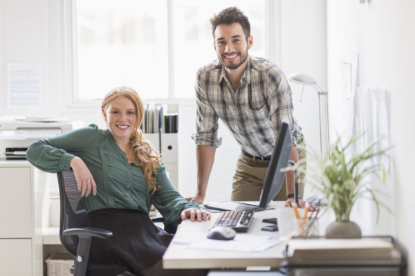 Business people smiling together in office