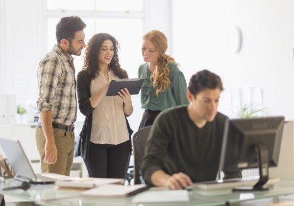 Business people using digital tablet in office