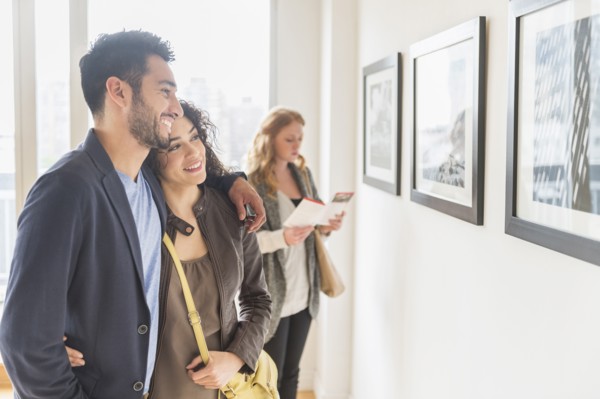 People admiring art in gallery