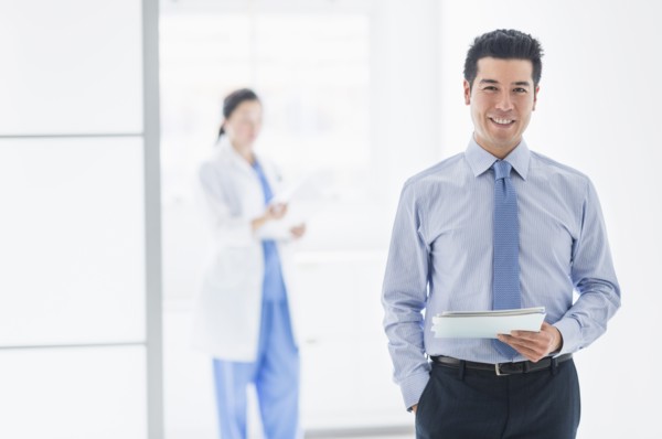 Businessman smiling in hospital