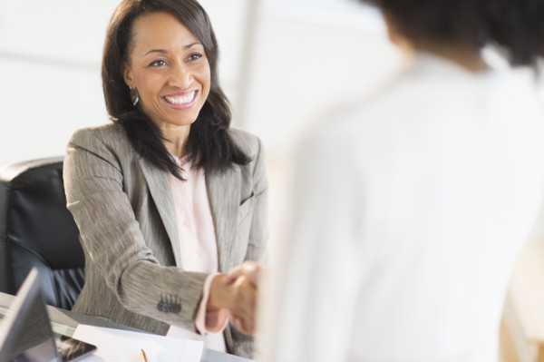 African American businesswomen shaking hands