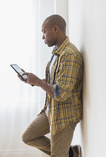 Black man using digital tablet