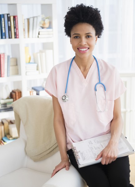 Black nurse smiling at home visit