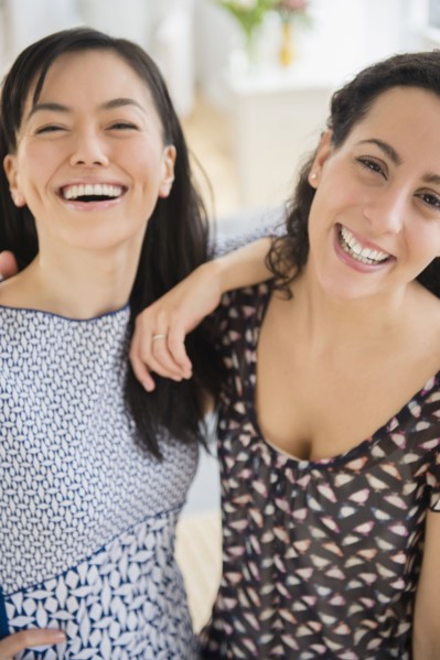 Smiling women standing together