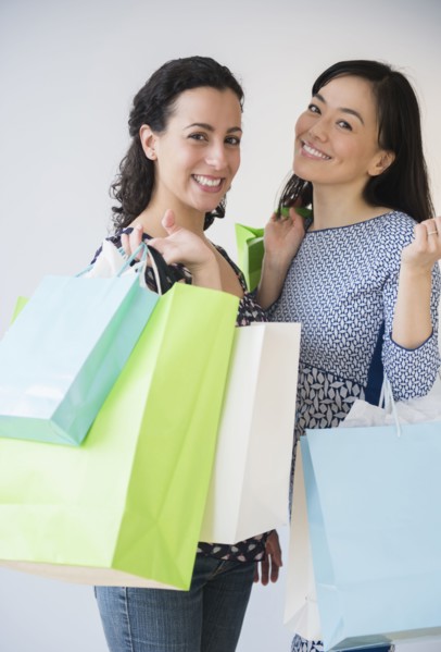 Smiling women shopping together
