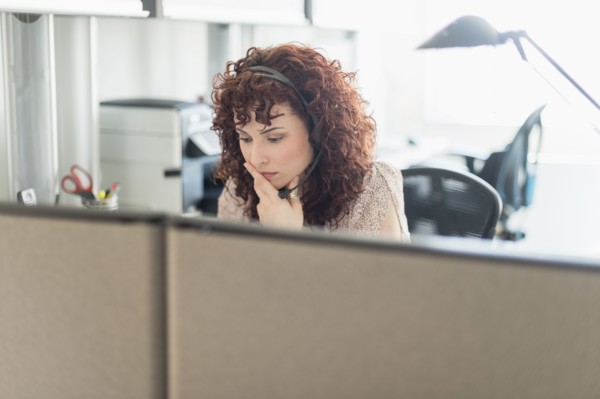 Hispanic businesswoman working in office