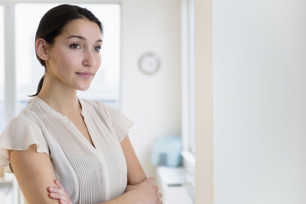 Caucasian businesswoman standing in office