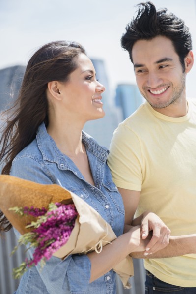 Couple walking together on city street