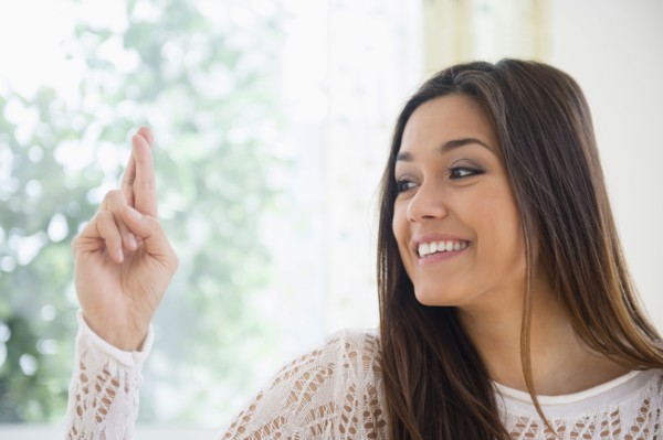 Woman crossing her fingers