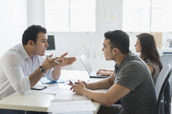 Hispanic business people working together in office