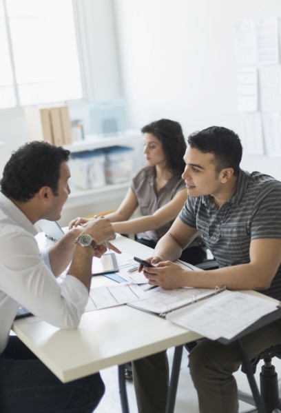 Hispanic business people working together in office