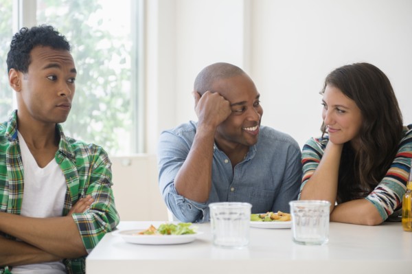 Man surprised at friends flirting