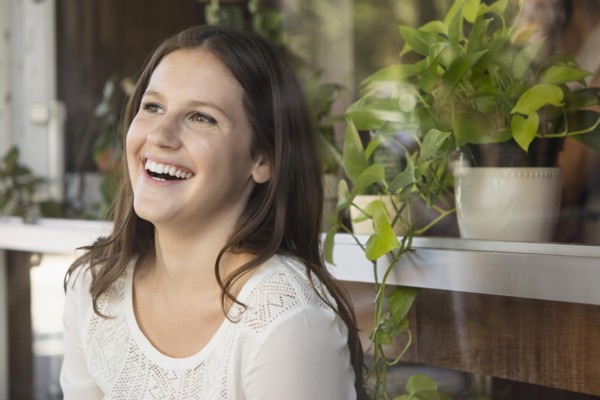 Caucasian woman laughing outdoors