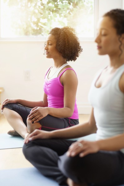 Women meditating in yoga class