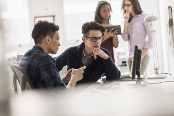 Businessmen working together in office
