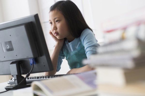 Chinese student using desktop computer