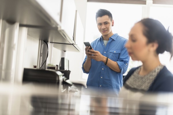 Business people using technology in office