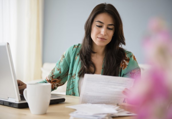 Woman paying bills on laptop