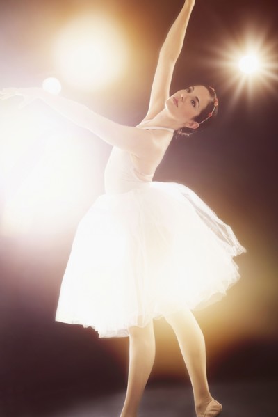 Hispanic ballet dancer performing on stage