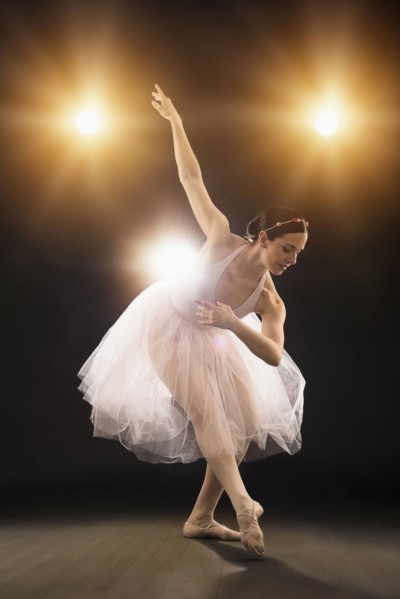 Hispanic ballet dancer performing on stage