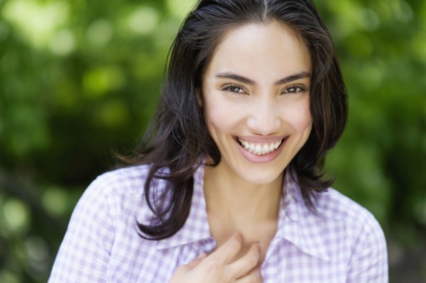 Hispanic woman smiling outdoors