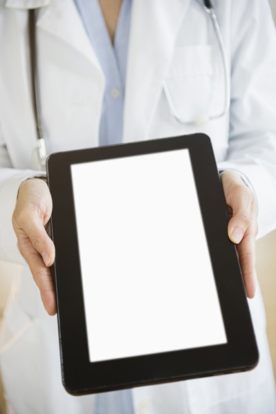 Mixed race doctor showing digital tablet