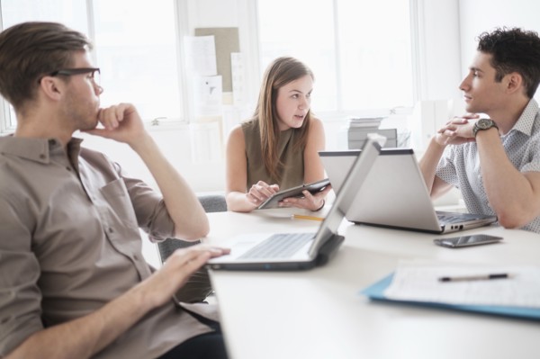 Business people using technology in office meeting