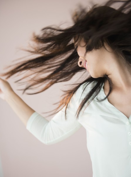 Chinese woman tossing her hair